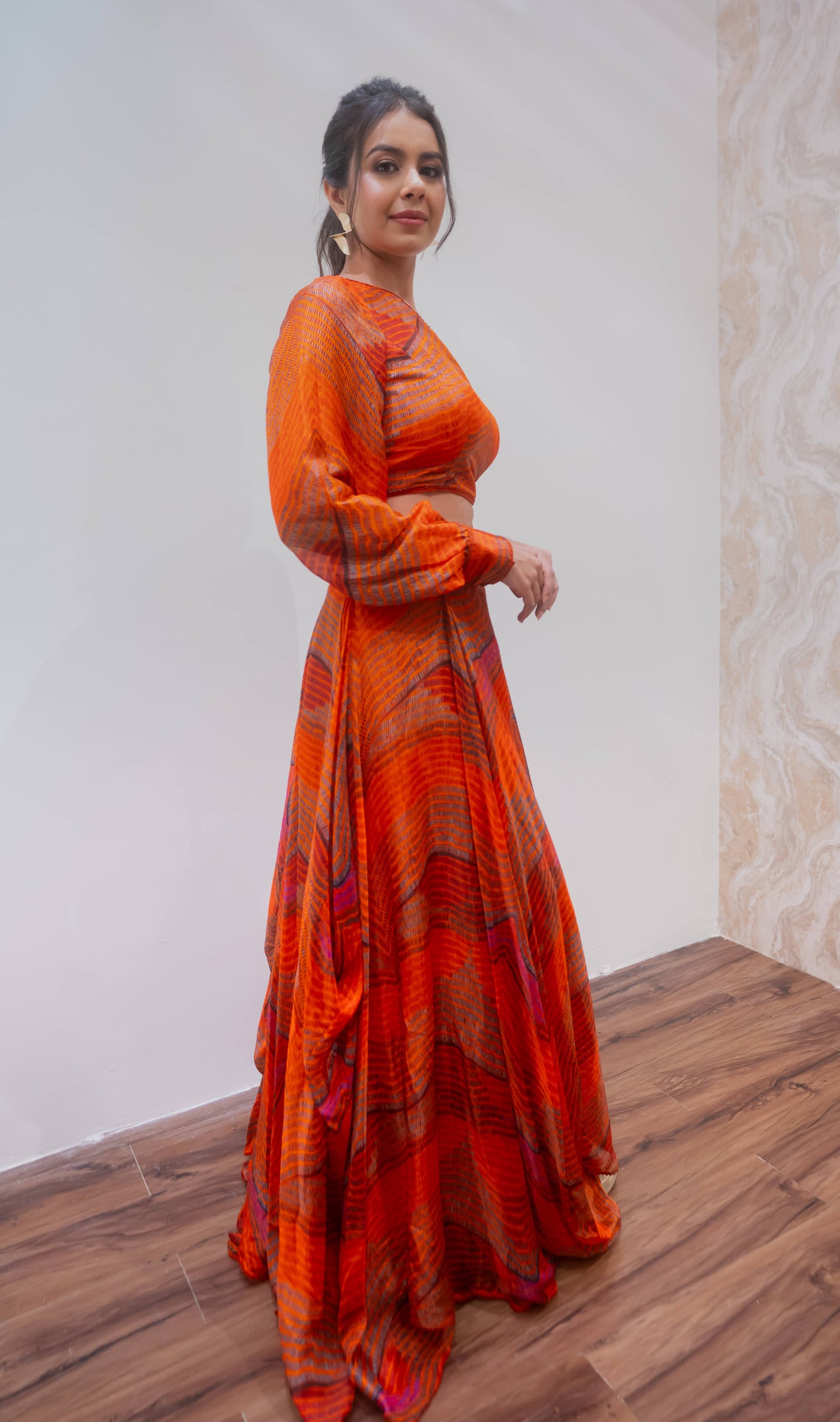 Orange one shoulder blouse and lehenga set