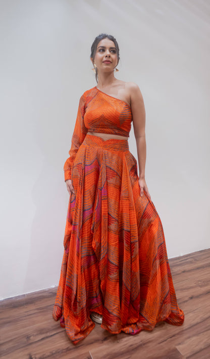 Orange one shoulder blouse and lehenga set