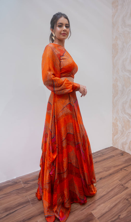 Orange one shoulder blouse and lehenga set